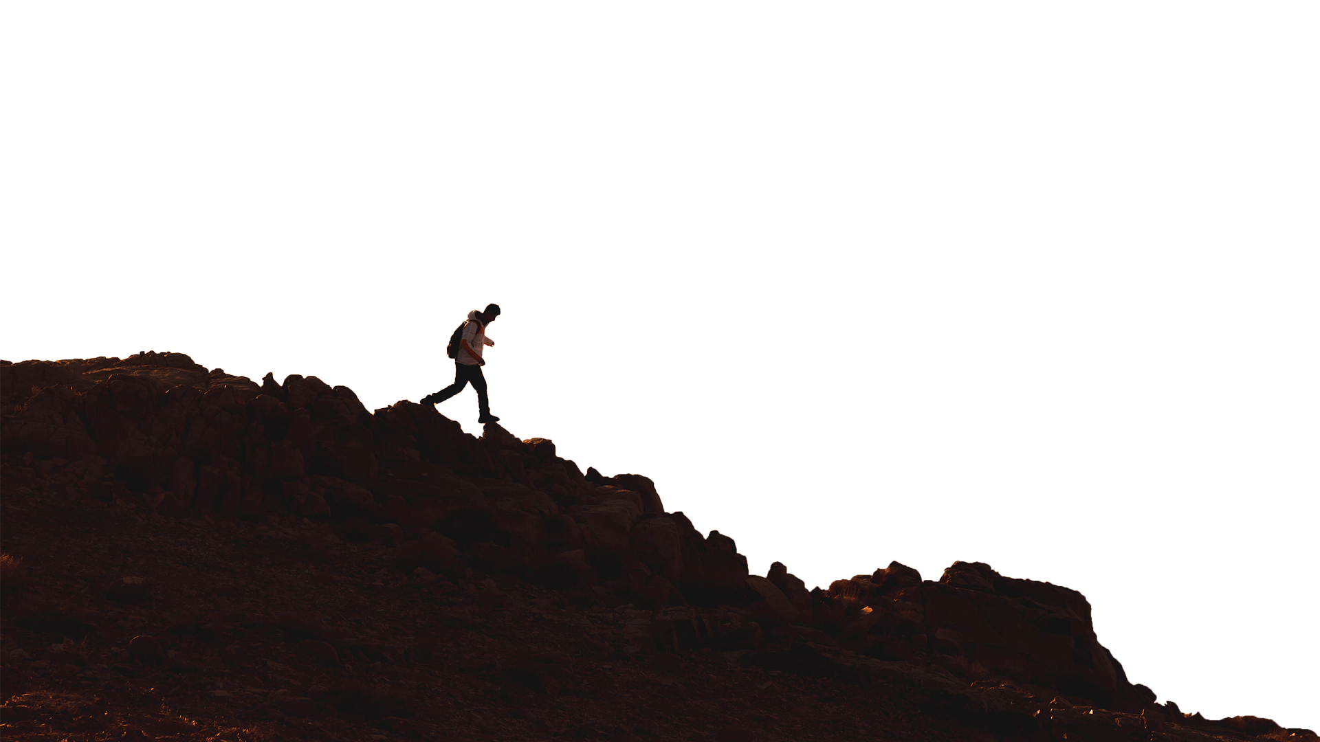 Silhoutte of people walking on mountain
